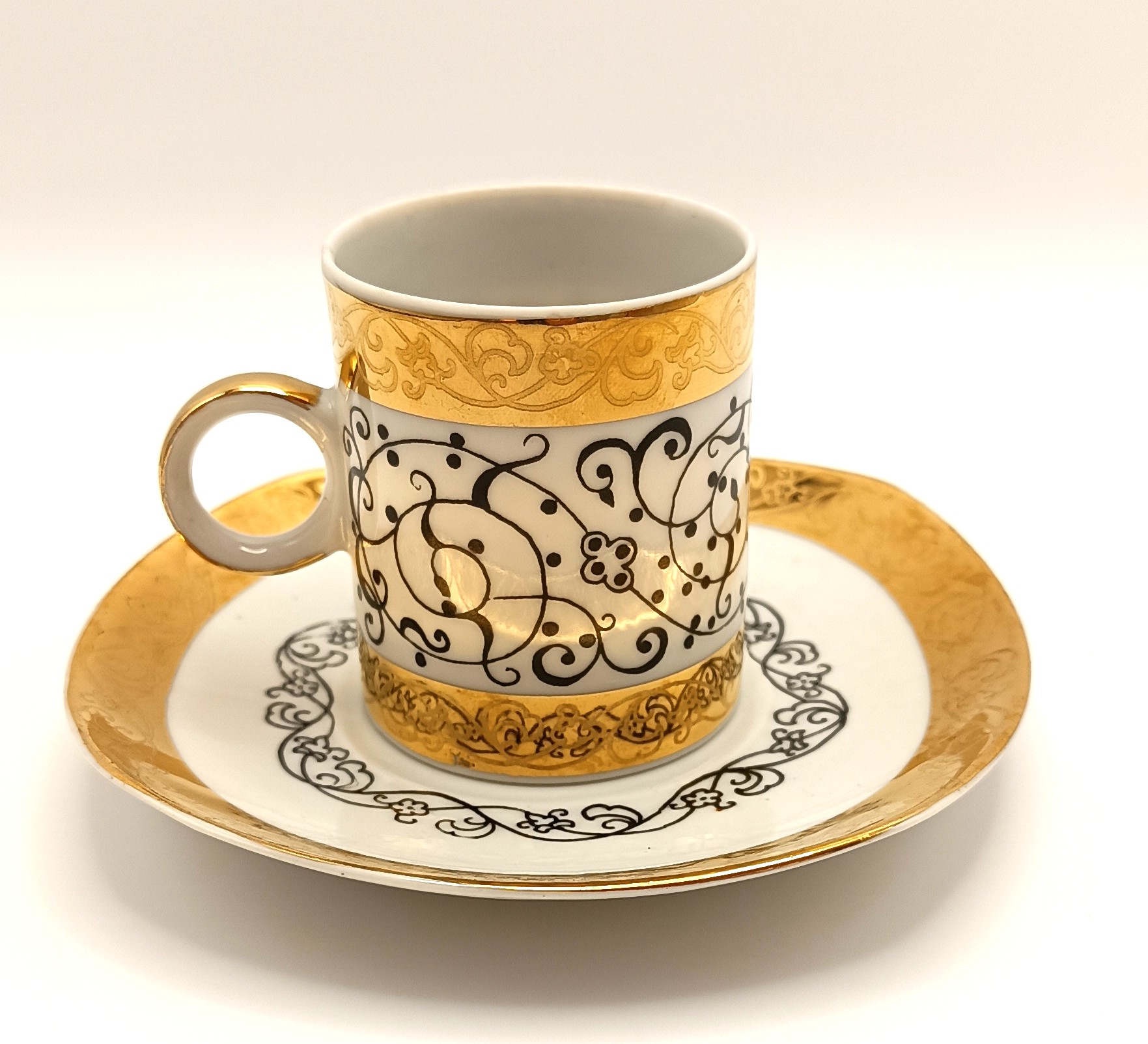 Rare Bulgarian EAB bone china espresso cup and saucer with gold decoration and black arabesque-style ornament