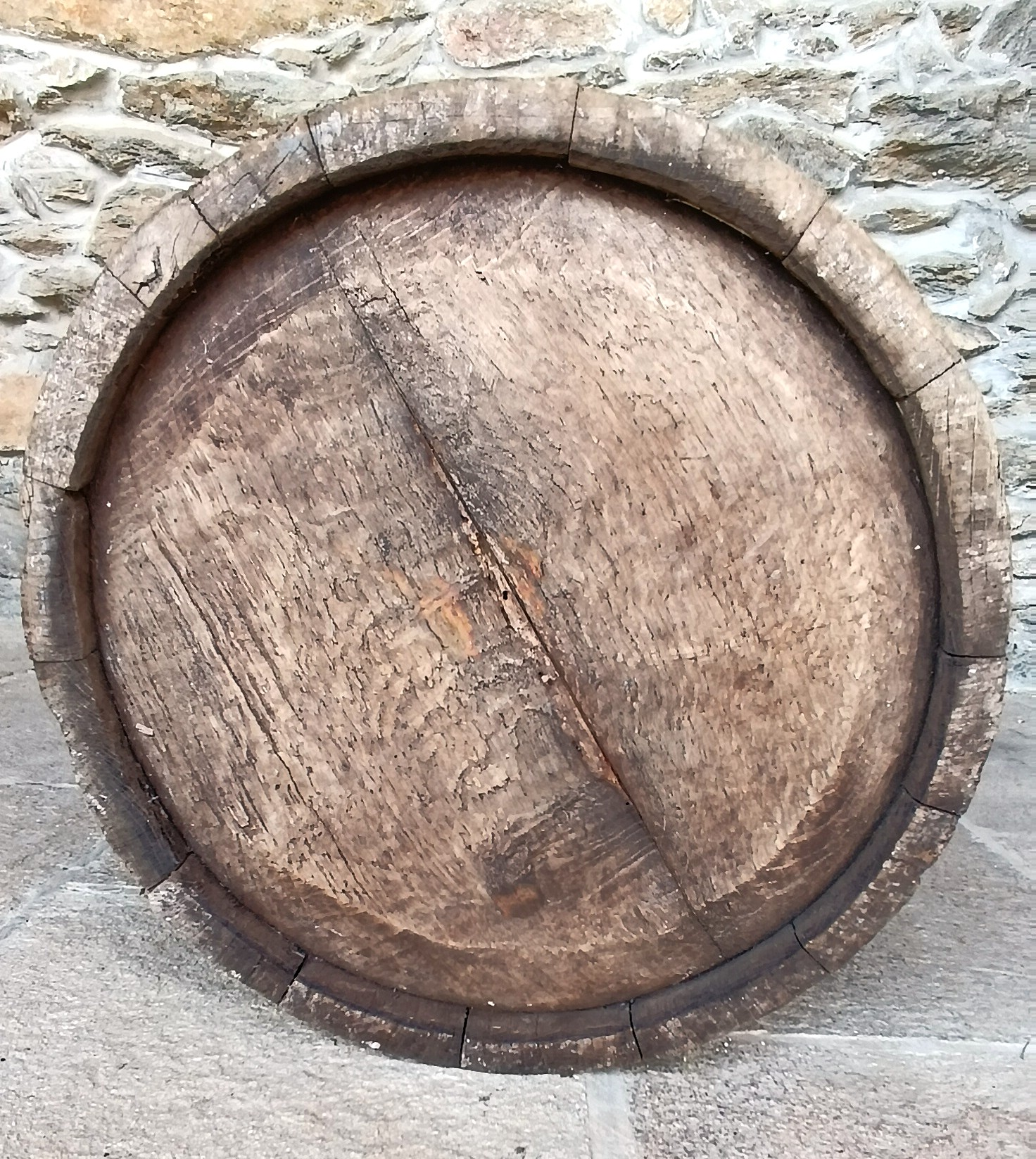Underside of antique Bulgarian Balkan coopered wooden vessel showing hand-fitted staves and aged wooden base, 19th century