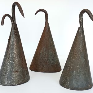 Set of three antique forged iron pig scraper bells used as traditional butcher tools