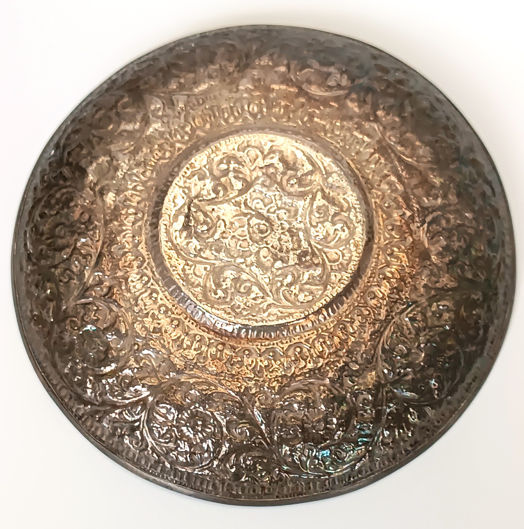 Underside of antique Kashmiri Anglo-Indian saucer with dense floral arabesque and chased decoration, circa 1900