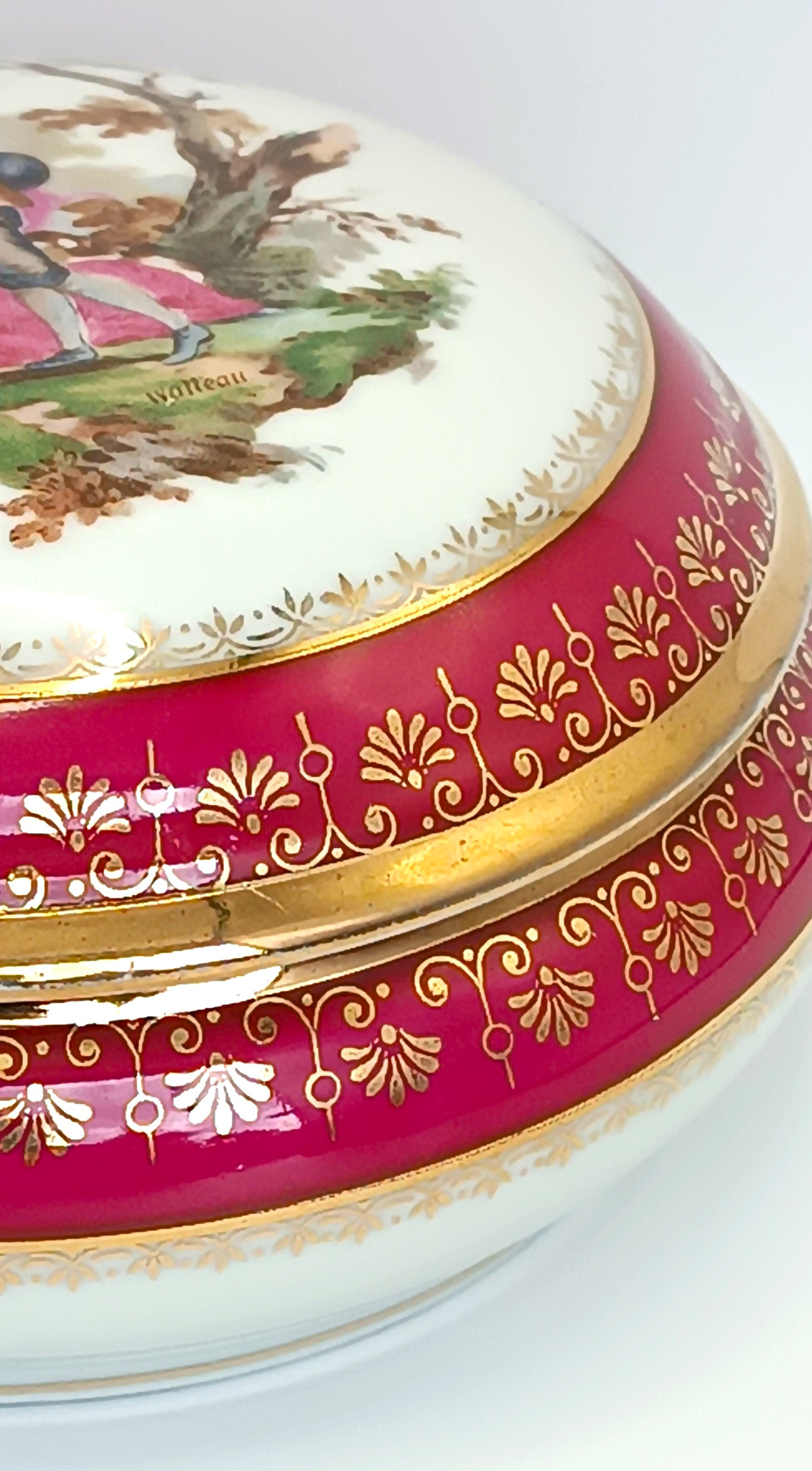 Detail of red and gilded decoration on a vintage Limoges France porcelain box