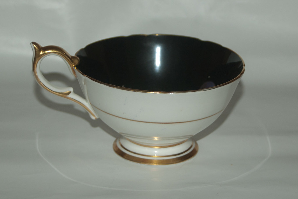 Vintage Aynsley Black and Gold Bone China Teacup Vintage Aynsley black and gold bone china teacup with ornate gilded decoration