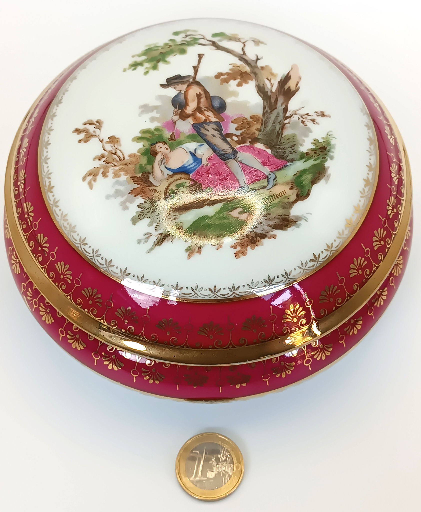 Vintage Limoges France porcelain box shown with a one euro coin for scale