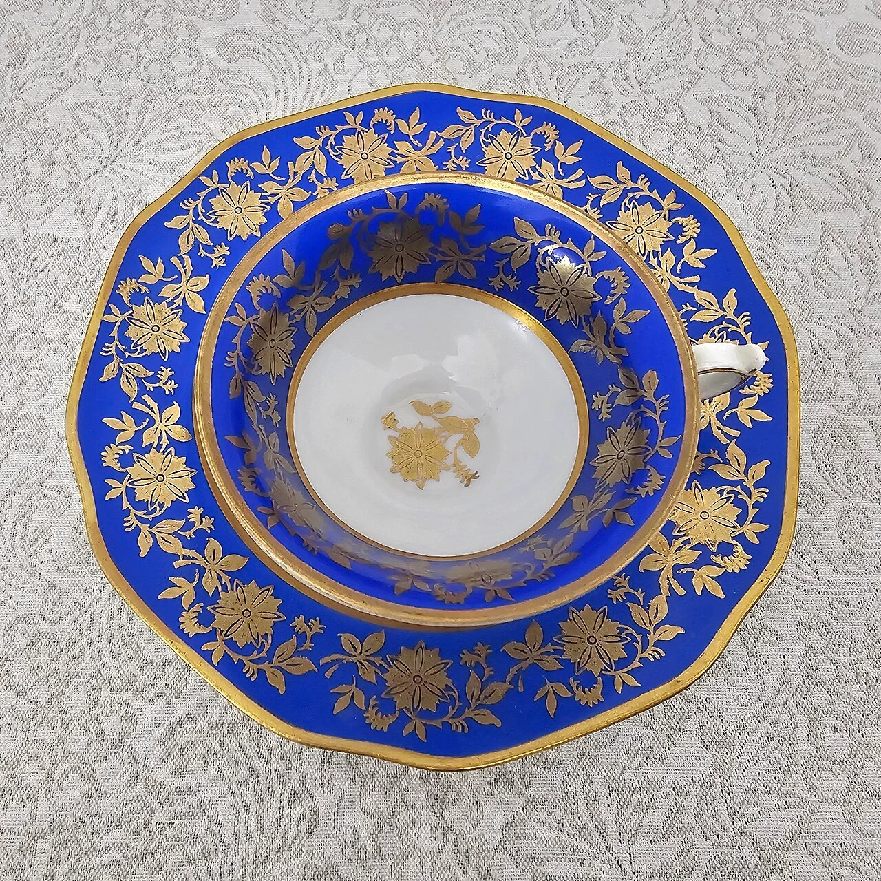 Bavarian porcelain cup and saucer with cobalt blue ground gold floral decoration and gilded rims