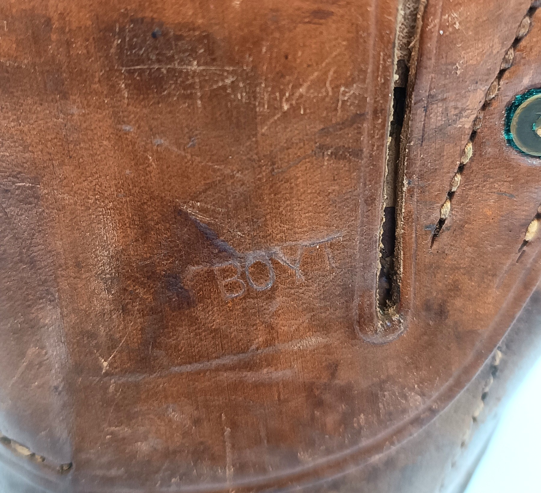 Close-up of the BOYT maker’s mark on an original U.S. M1916 leather holster for Colt M1911/M1911A1