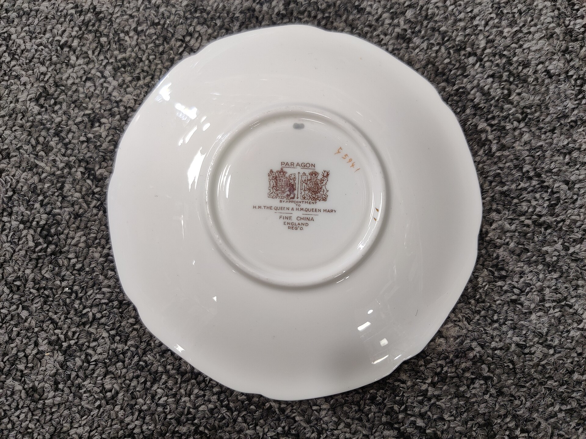 Paragon China double Royal Warrant backstamp for H.M. The Queen and H.M. Queen Mary on the base of a porcelain plate