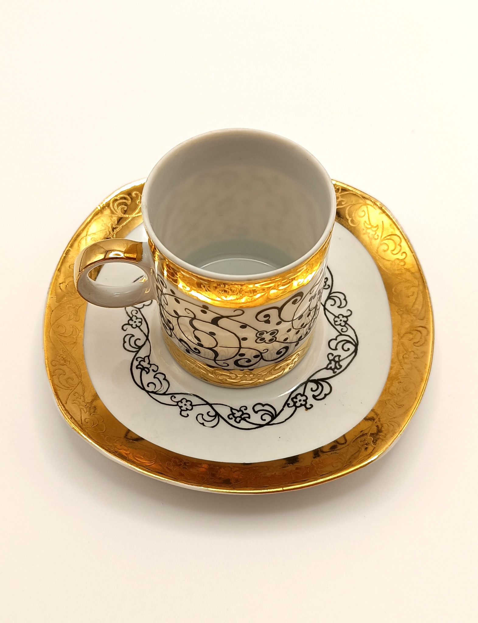Rare Bulgarian EAB bone china espresso cup and saucer with rich gold decoration and black arabesque ornament