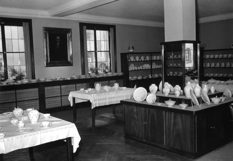Historic Seltmann Weiden porcelain factory showroom in 1954 with cups, plates, jugs and tableware displayed in cabinets and on tables