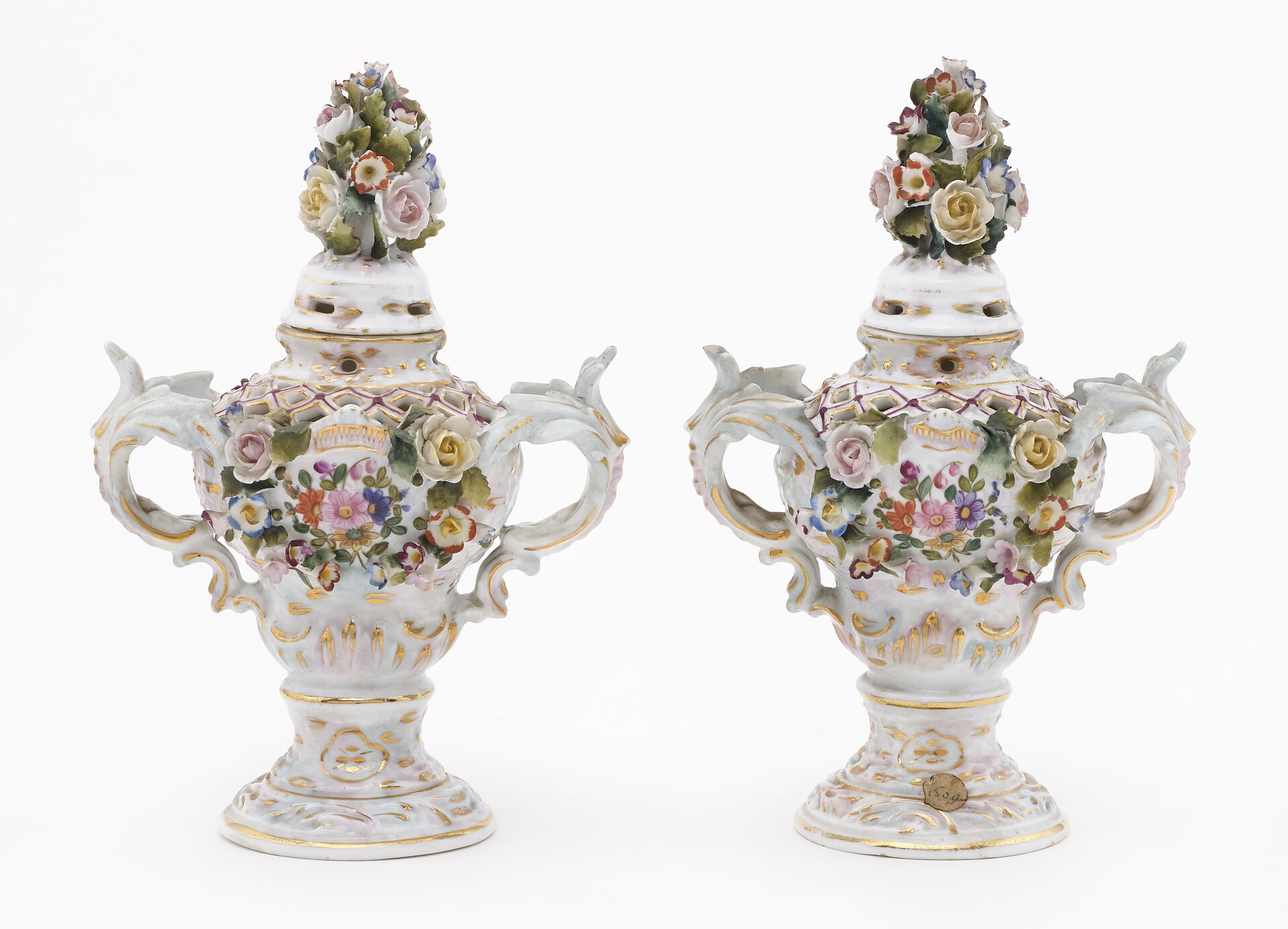 Pair of Sitzendorf porcelain decorative vases with hand-painted flowers, applied floral decoration and gilded details