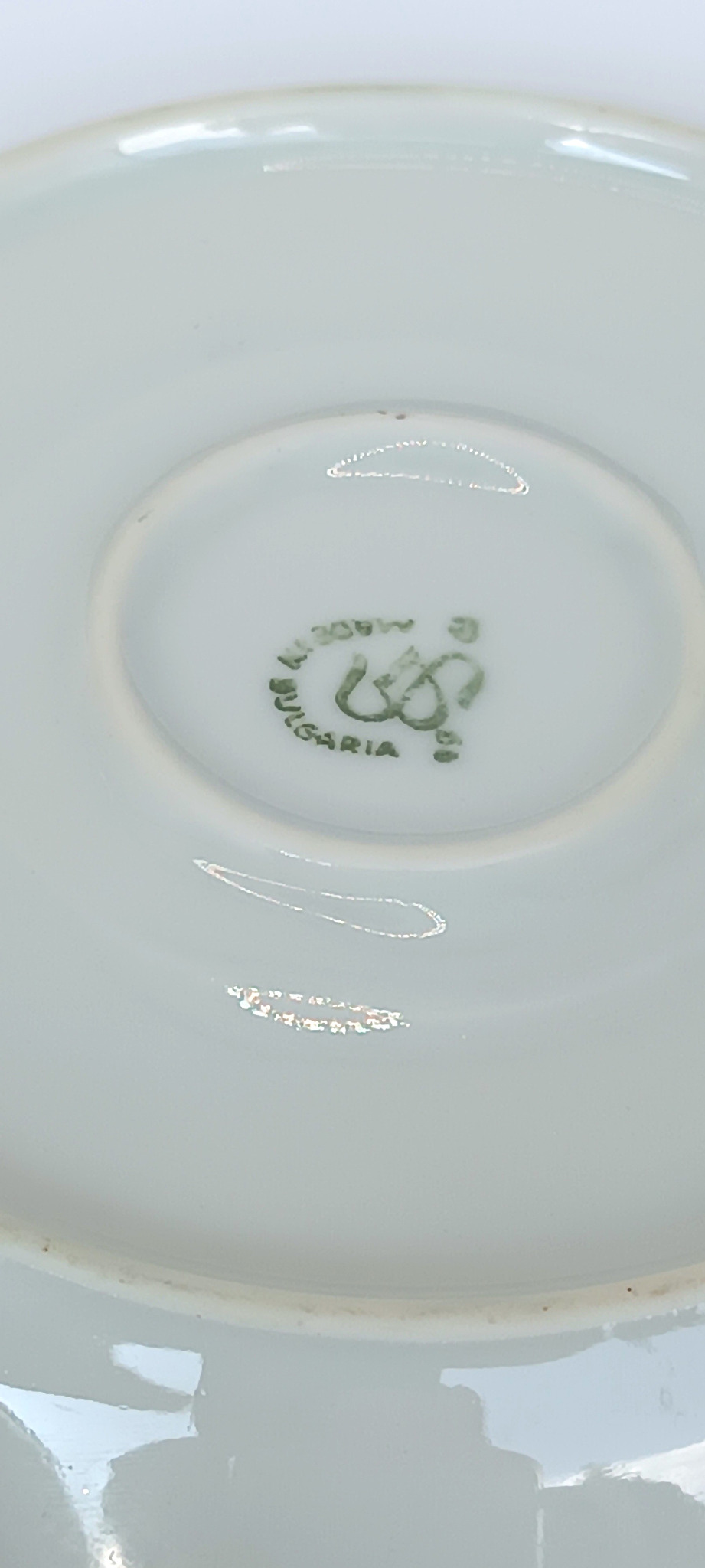 Close-up of a vintage Bulgarian porcelain base showing a green factory backstamp with the word Bulgaria and a stylized maker mark