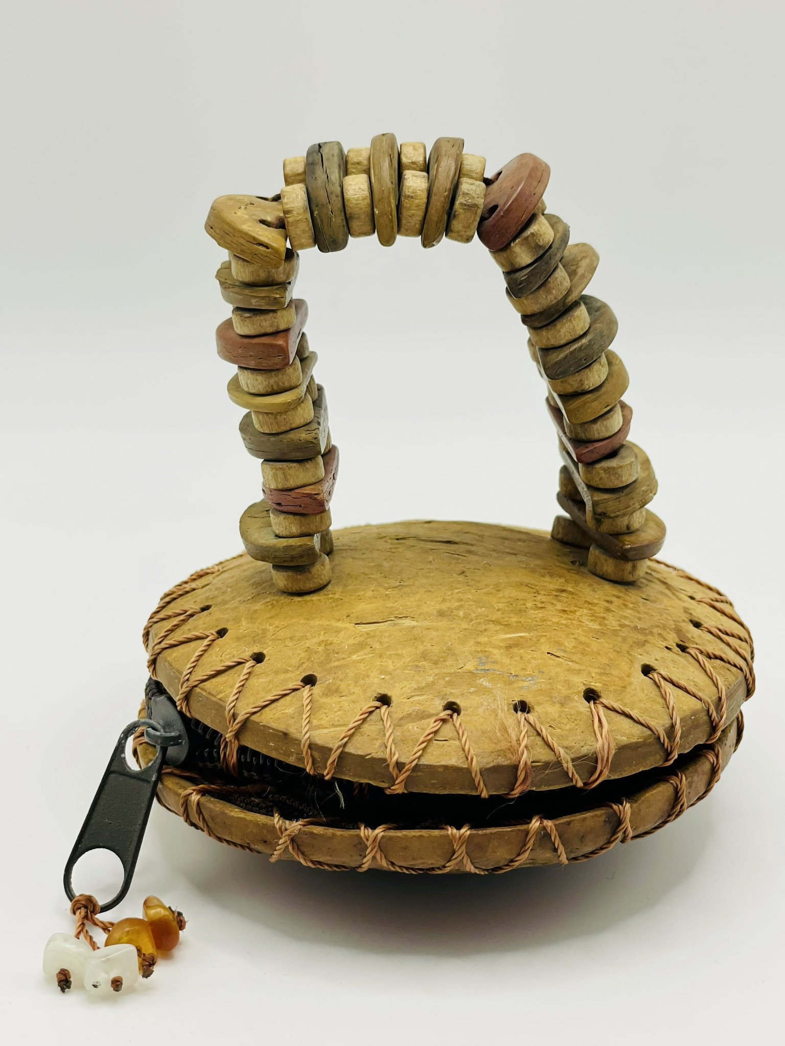 Vintage handmade coconut shell purse with decorative handle, hand-stitched edges, zip closure and bead detail