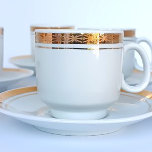Vintage Bulgarian Kitka porcelain coffee cup and saucer with broad gold-tone decorative band and fine linear detail