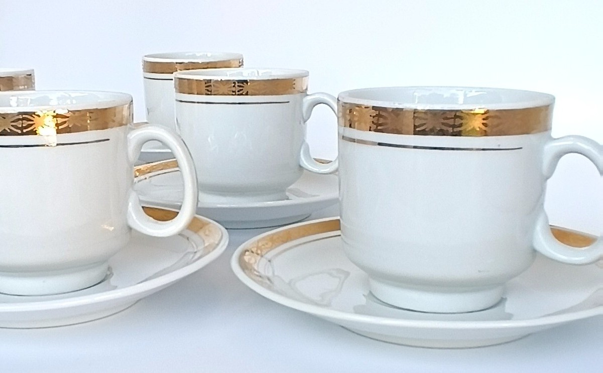 Vintage Bulgarian Kitka porcelain coffee cups and saucers with broad gold-tone bands and fine decorative borders