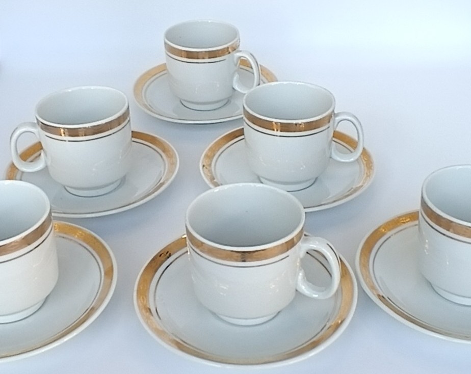 Vintage Bulgarian Kitka porcelain coffee set with six white cups and matching saucers decorated with gold-tone bands