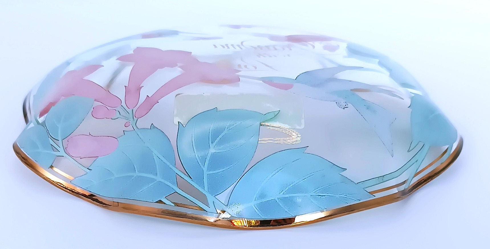 Side profile of a vintage 1991 Lefton Japan decorative glass plate with reverse floral design, hummingbirds and gold-tone rim