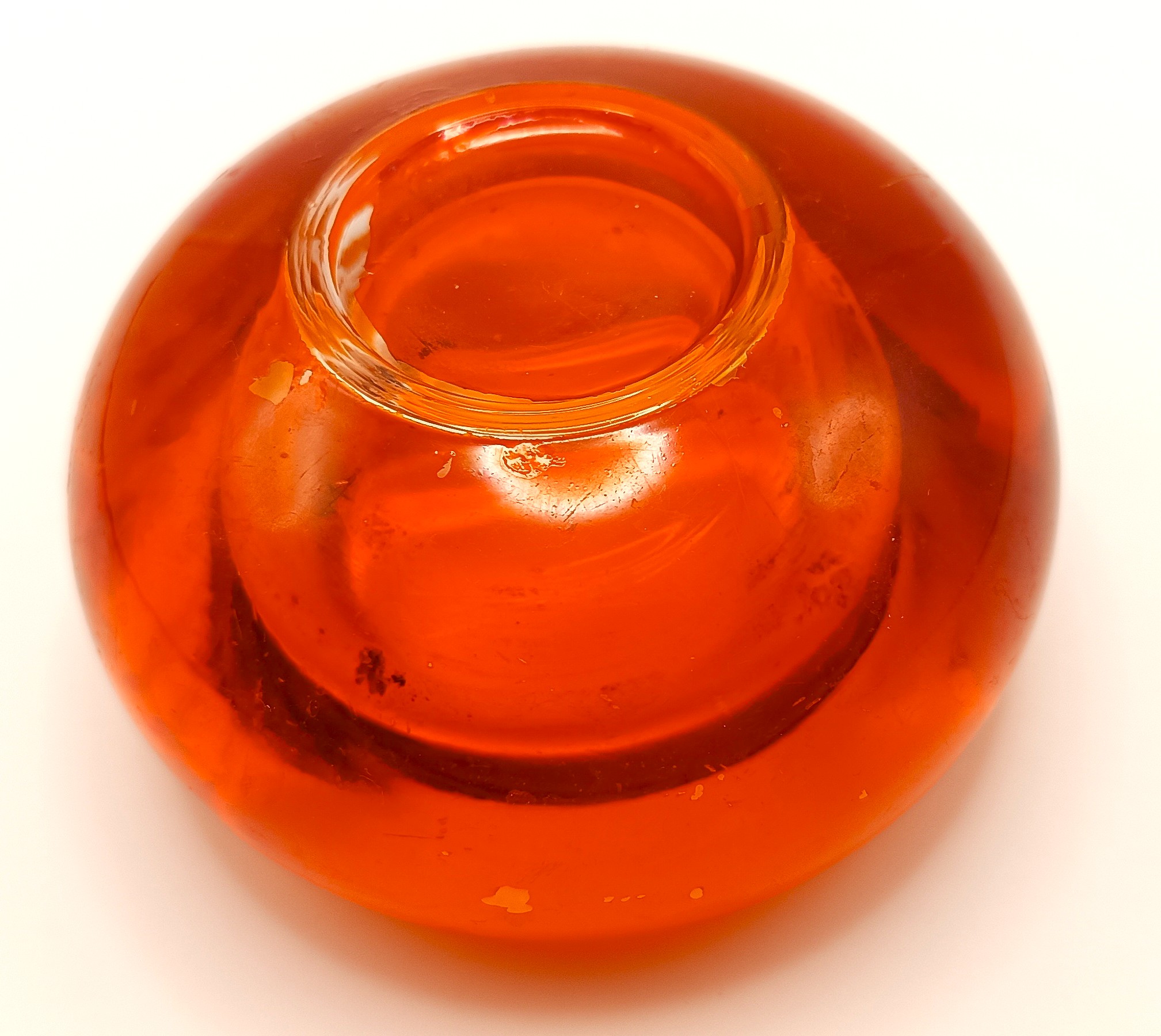 Base of a vintage LEONARDO orange art glass tealight candle holder