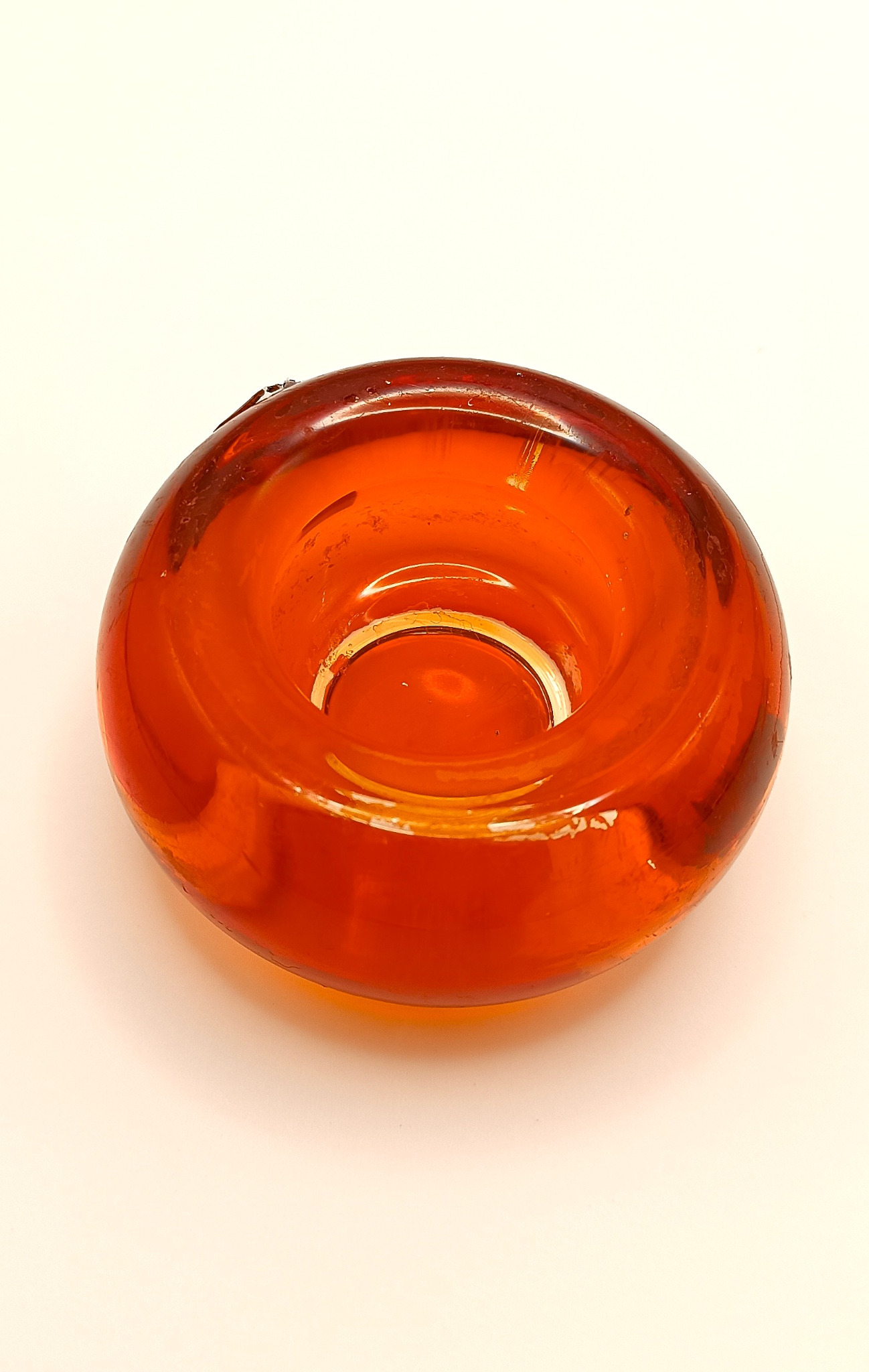 Top view of a vintage LEONARDO orange art glass tealight candle holder