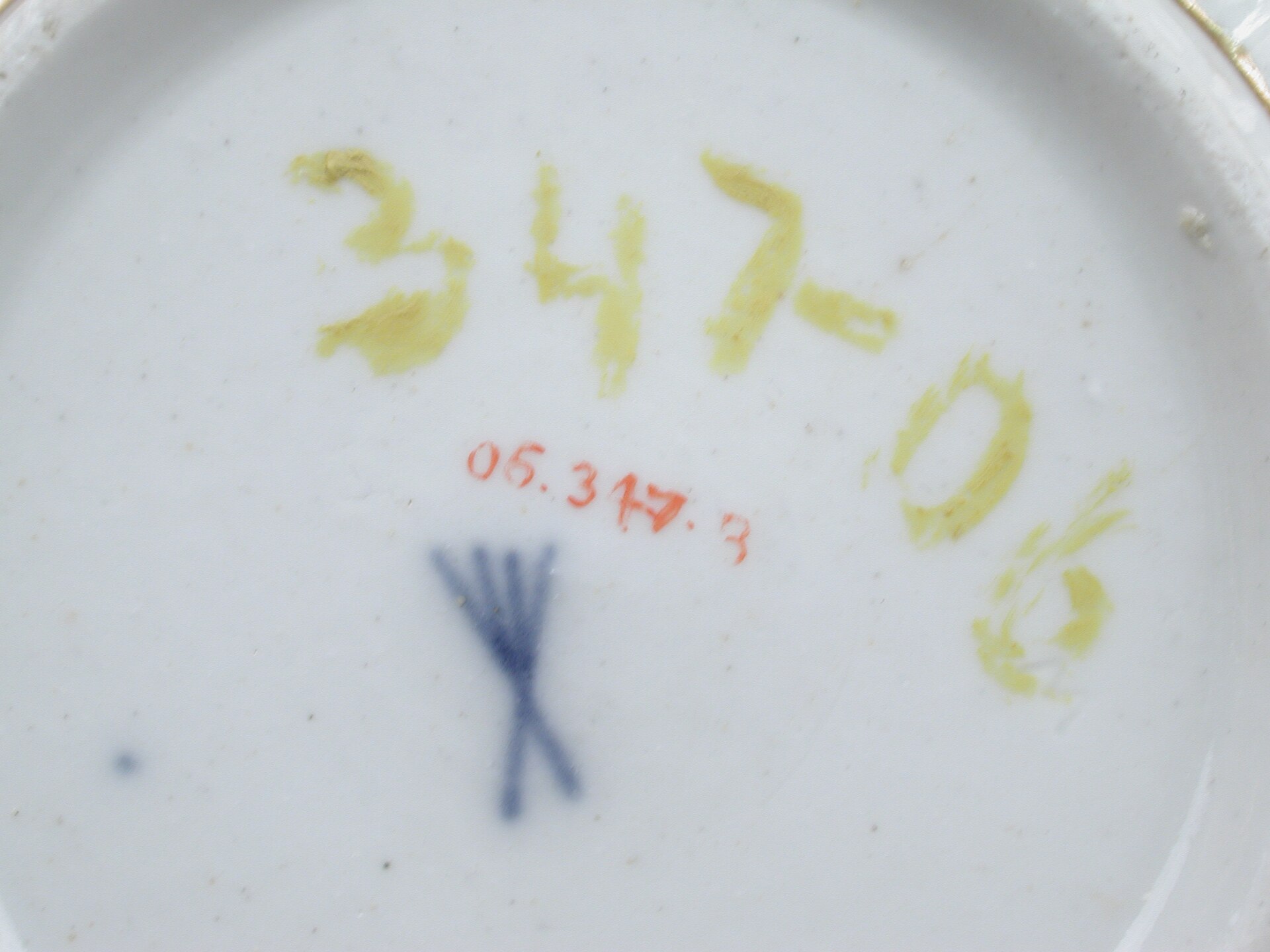 Base of a late 18th-century Volkstedt porcelain saucer showing an underglaze blue factory mark