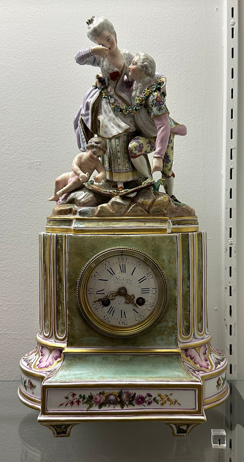 Wallendorf porcelain clock with figural group, hand-painted floral decoration and gilded details, circa 1860–1880