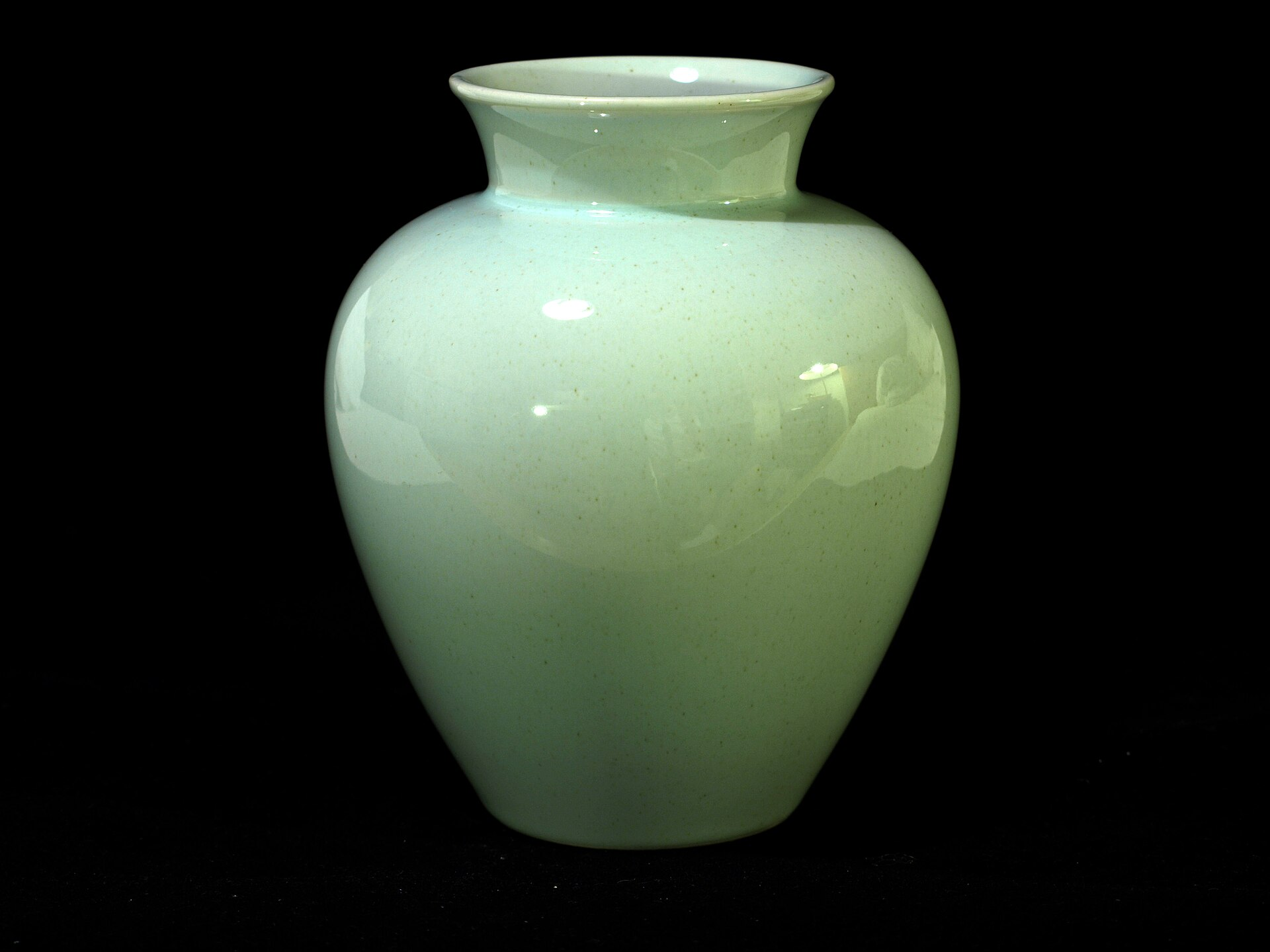 Pale green Arzberg Form 1382 porcelain vase with rounded body, narrow neck and gently flared opening