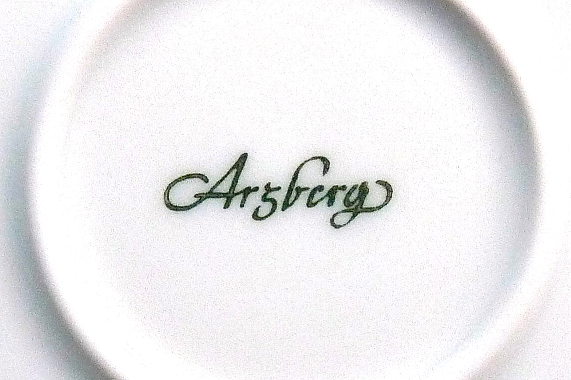 Authentic green cursive Arzberg porcelain backstamp photographed on a white ceramic base and associated with 1950s to 1960s production