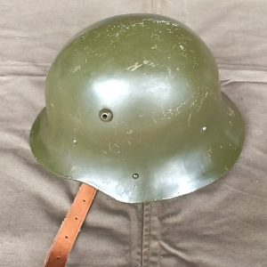Bulgarian M36 Type A steel helmet refurbished for the Bulgarian People's Army, showing its rounded crown, olive-green shell, ventilation hole, rivets and leather chinstrap.