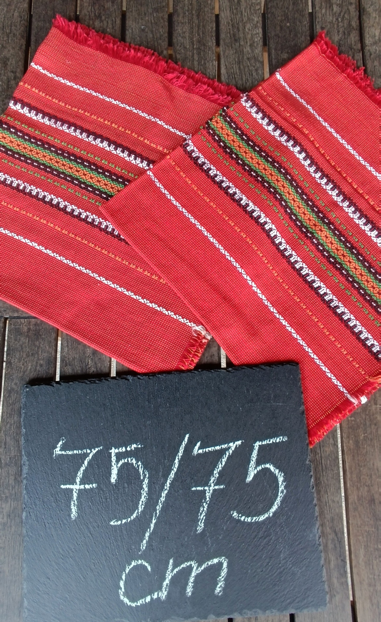 Vintage Bulgarian folk tablecloth with red woven ground, traditional geometric stripes and approximate size of 79 × 75 cm