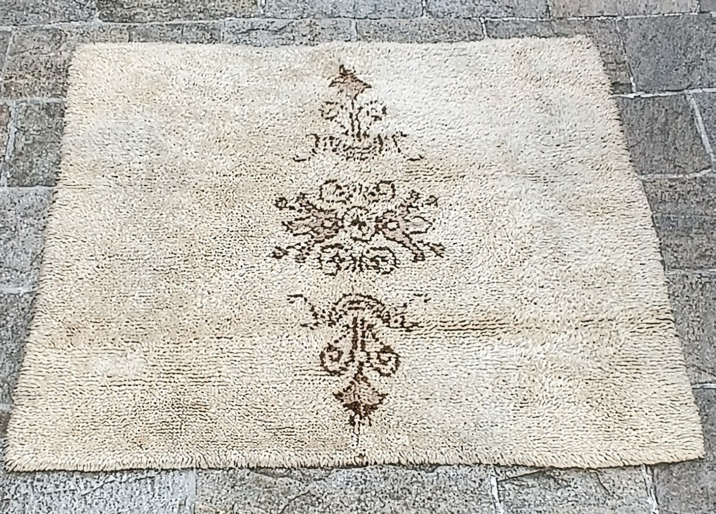 Vintage Bulgarian handwoven wool kitenik / guber with cream long pile and brown folk motifs, approximately 145 × 145 cm