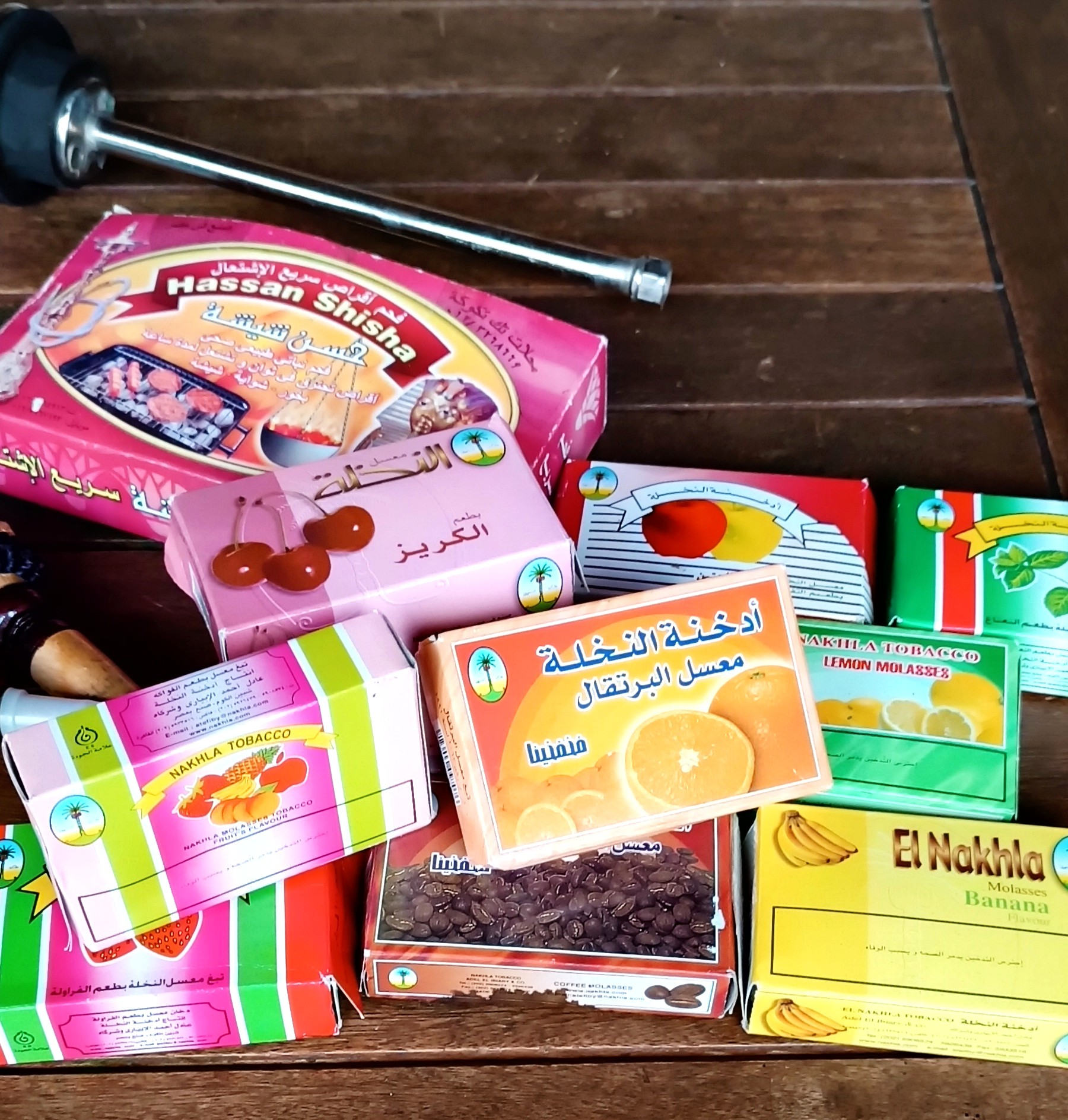 Historical Egyptian Nakhla Tobacco flavour boxes and Hassan Shisha charcoal packaging preserved as documentary material with a vintage hookah collection